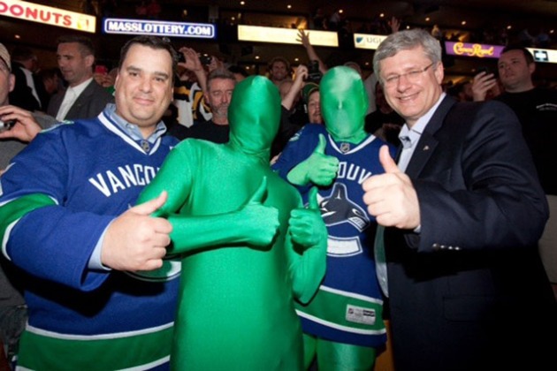 The Green Men with Prime Minister Stephen Harper and Heritage Minister James Moore. // Photo courtesy of The Green Men